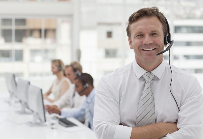 Customer service agent in busy call center.